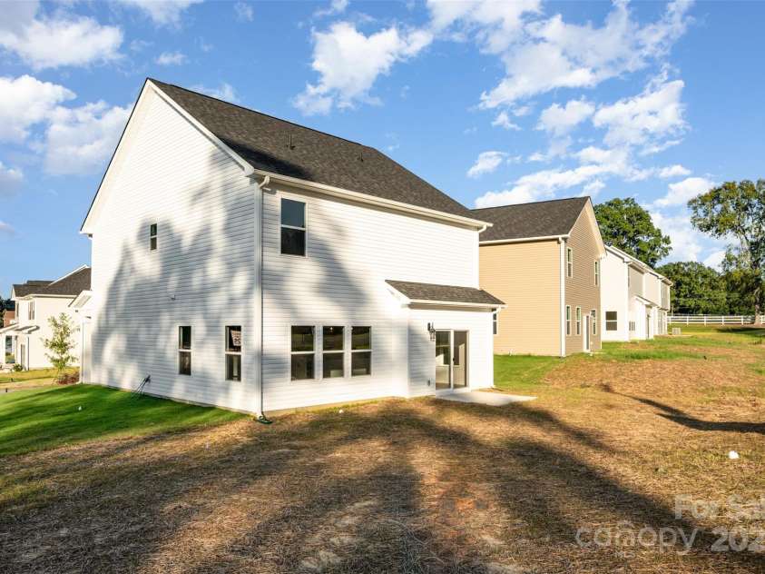 2059 Sadler Woods Lane, Charlotte, NC 28214.  MLS# CAR4265584, YatesRealty ID 1669. Back view of home. Representational Photo.