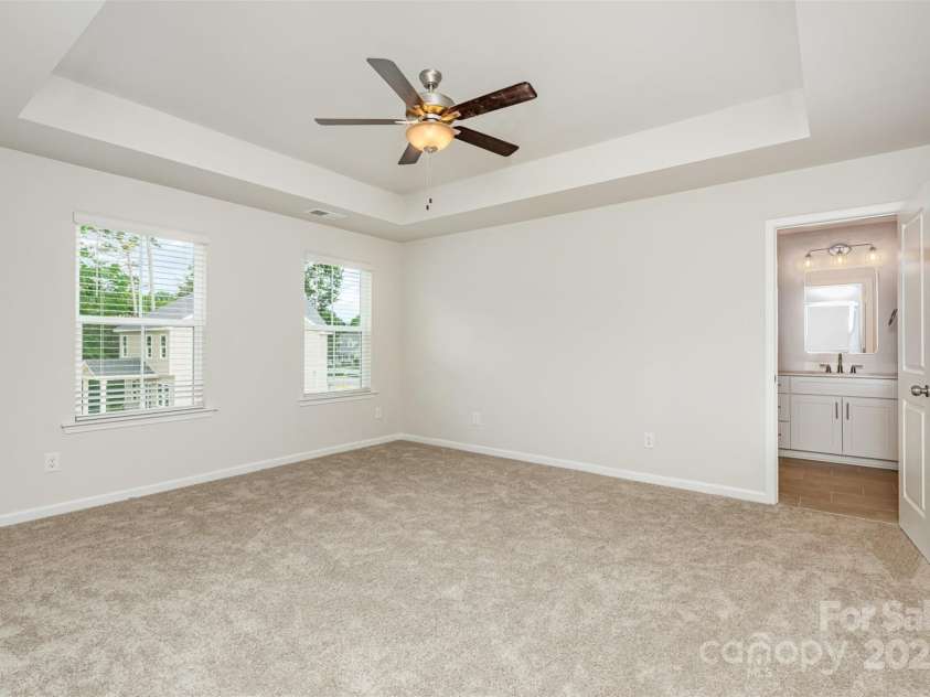 2059 Sadler Woods Lane, Charlotte, NC 28214.  MLS# CAR4265584, YatesRealty ID 1669. Primary bedroom w/ ceiling fan. Representational Photo.