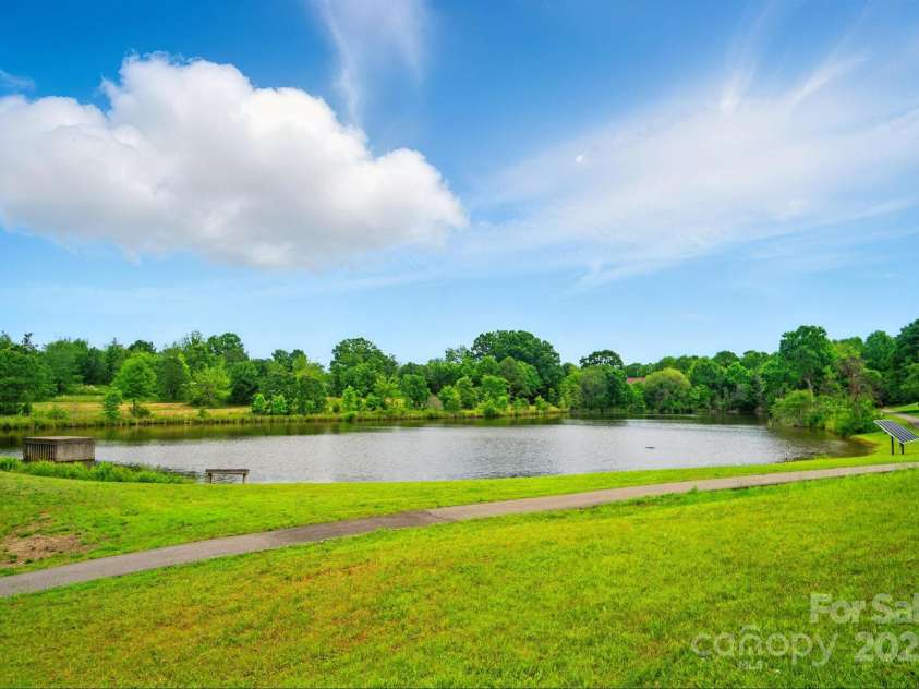 138 Montibello Drive, Mooresville, NC 28117.  MLS# CAR4258510, YatesRealty ID 16694. 4 Acre Stocked Fishing Pond right behond home