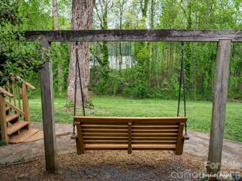 234 Edgewood Drive, Statesville, NC 28625.  MLS# CAR4364089, YatesRealty ID 16694. Virtually staged swing overlooking private backyard