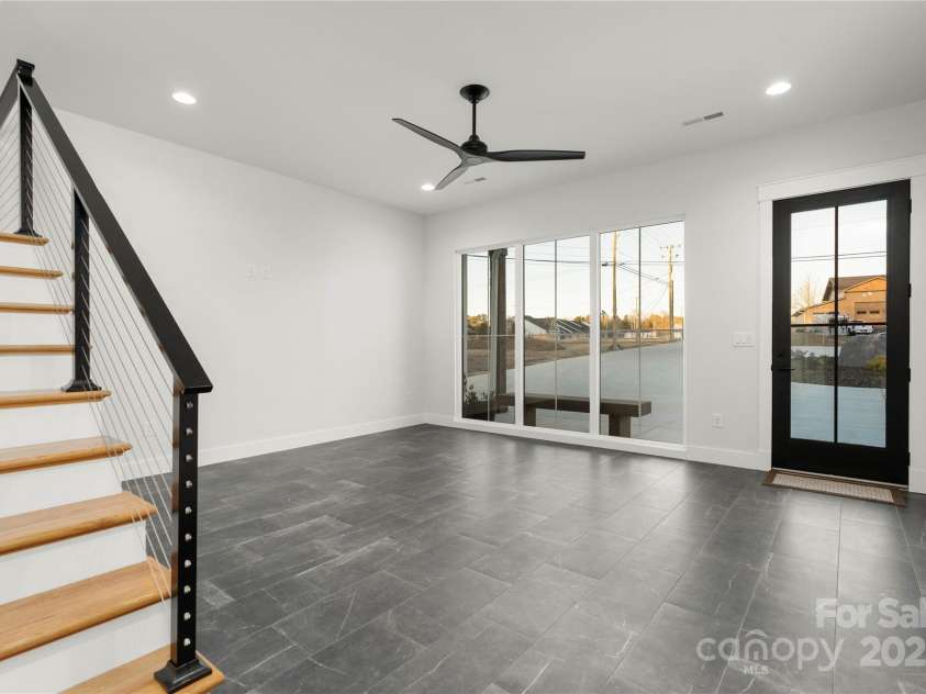 108 Isle Of Pines Road, Mooresville, NC 28117.  MLS# CAR4307197, YatesRealty ID 167. Lower level sitting area at entrance - interior of lot 1 home