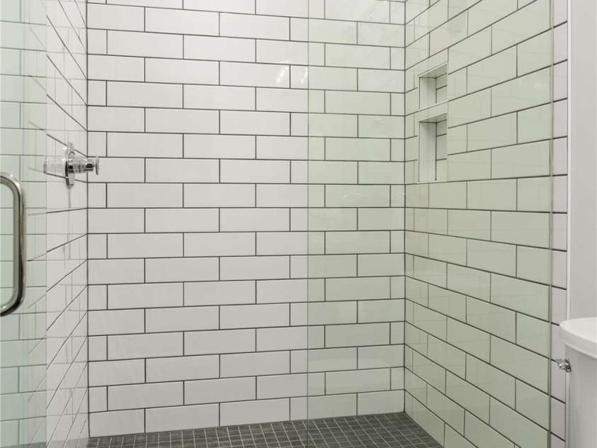 108 Isle Of Pines Road, Mooresville, NC 28117.  MLS# CAR4307197, YatesRealty ID 167. Lower level walk-in shower conveniently located directly off garage - interior of lot 1 home