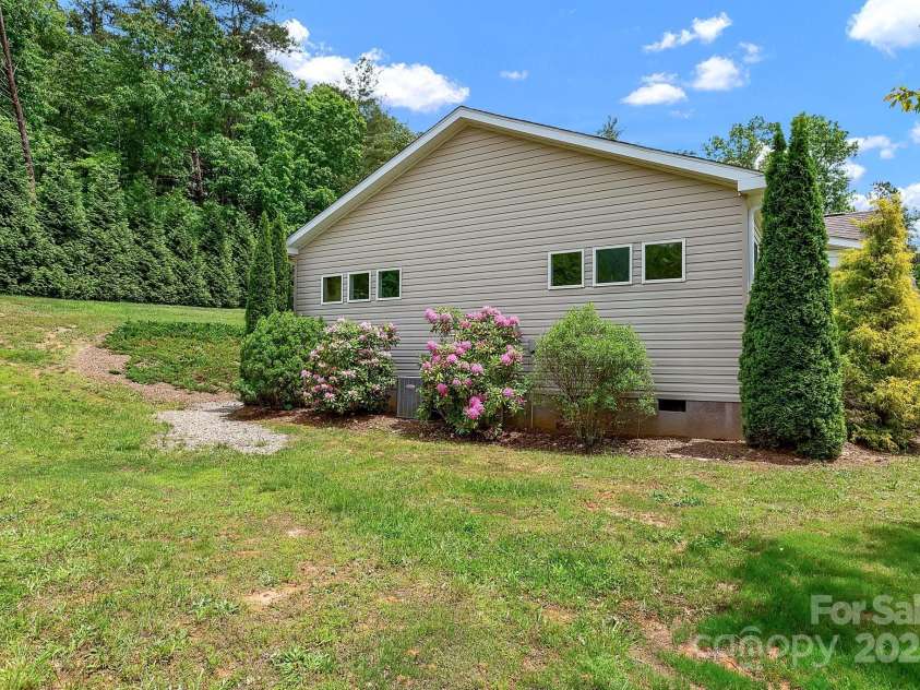 52 Luther Cove Road, Candler, NC 28715.  MLS# CAR4257069, YatesRealty ID 16701. Side Yard