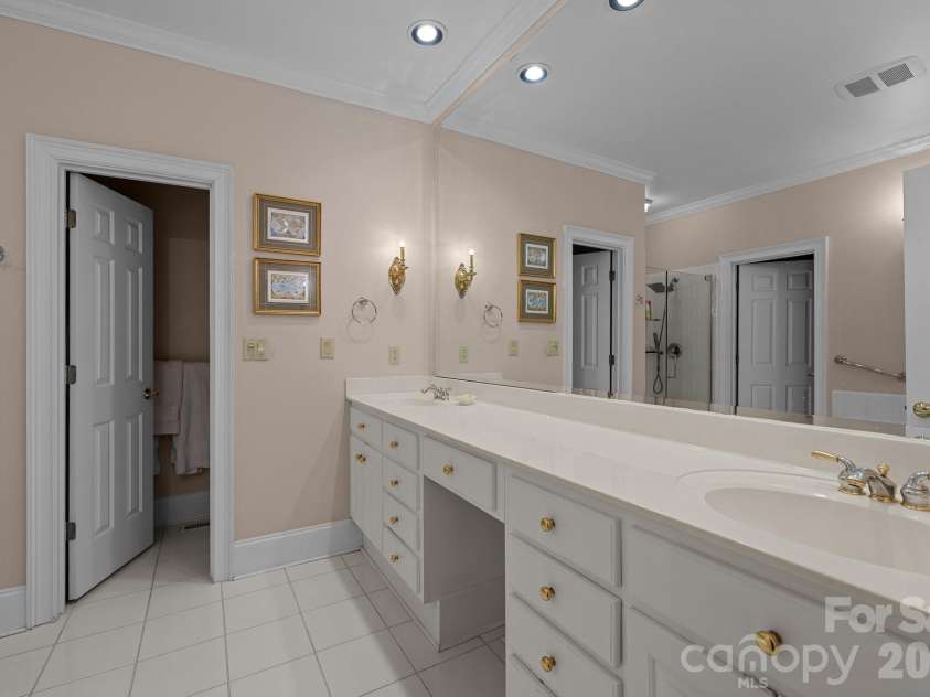 10317 Clubhouse View Lane, Mint Hill, NC 28227.  MLS# CAR4313270, YatesRealty ID 16705. Double sinks and water closet.