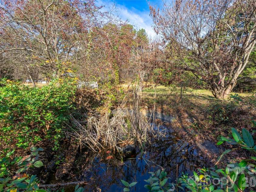 228 Brumley Road, Mooresville, NC 28115.  MLS# CAR4322912, YatesRealty ID 16706. Koi pond