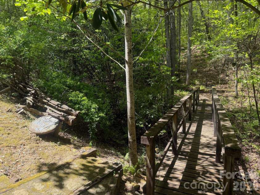 427 Wingfield Way, Brevard, NC 28712.  MLS# CAR4372461, YatesRealty ID 16709. Another small bridge on the property to trails. 