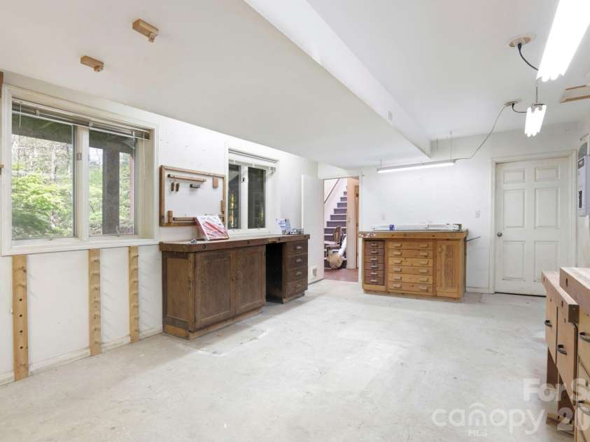 427 Wingfield Way, Brevard, NC 28712.  MLS# CAR4372461, YatesRealty ID 16709. Wood shop in the basement 