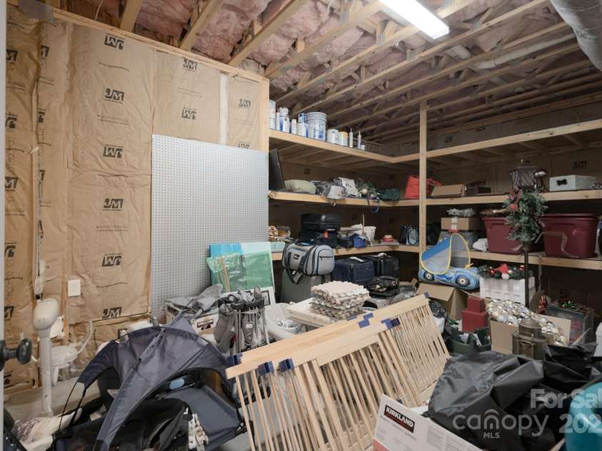228 Black Mountain Drive, Fort Mill, SC 29708.  MLS# CAR4225909, YatesRealty ID 1671. Basement storage room with built-in shelves