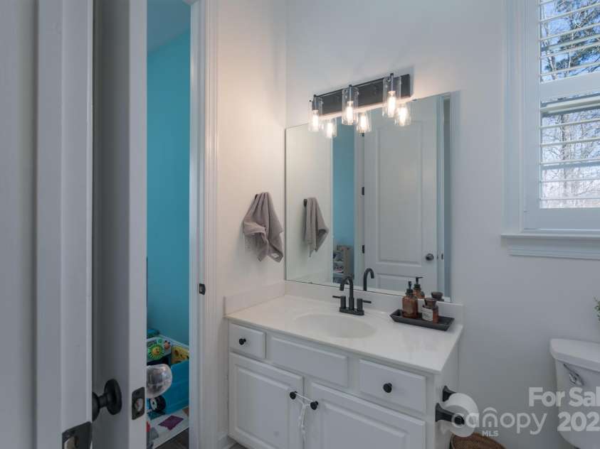 228 Black Mountain Drive, Fort Mill, SC 29708.  MLS# CAR4225909, YatesRealty ID 1671. Main floor full bath connected to main floor bedroom