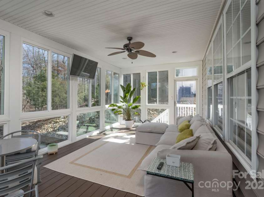 228 Black Mountain Drive, Fort Mill, SC 29708.  MLS# CAR4225909, YatesRealty ID 1671. Screened/Glassed porch off kitchen with outside stairs down to pool/patio/hot tub