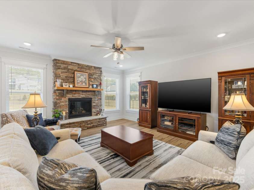 702 Yucatan Drive, Waxhaw, NC 28173.  MLS# CAR4223915, YatesRealty ID 1672. Family Room with stone fireplace, gas logs and cedar mantel