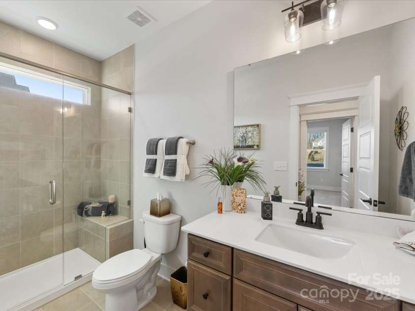 702 Yucatan Drive, Waxhaw, NC 28173.  MLS# CAR4223915, YatesRealty ID 1672. Full bathroom with shower on main level