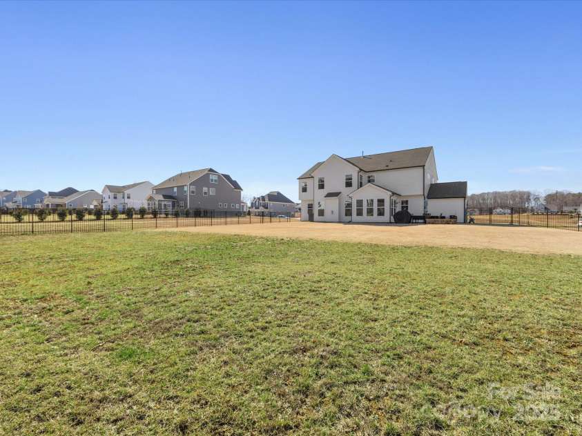 702 Yucatan Drive, Waxhaw, NC 28173.  MLS# CAR4223915, YatesRealty ID 1672. Large fenced rear yard