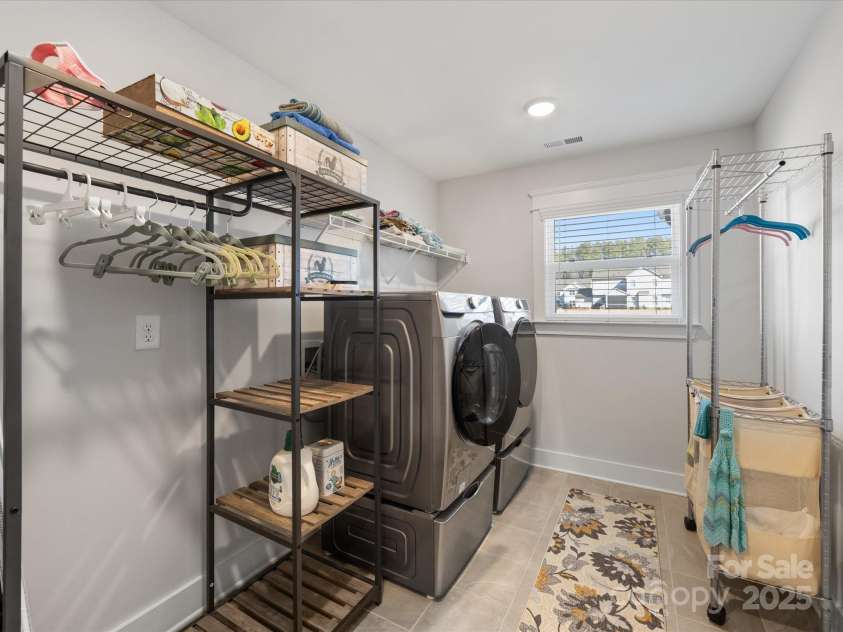 702 Yucatan Drive, Waxhaw, NC 28173.  MLS# CAR4223915, YatesRealty ID 1672. Laundry Room with storage