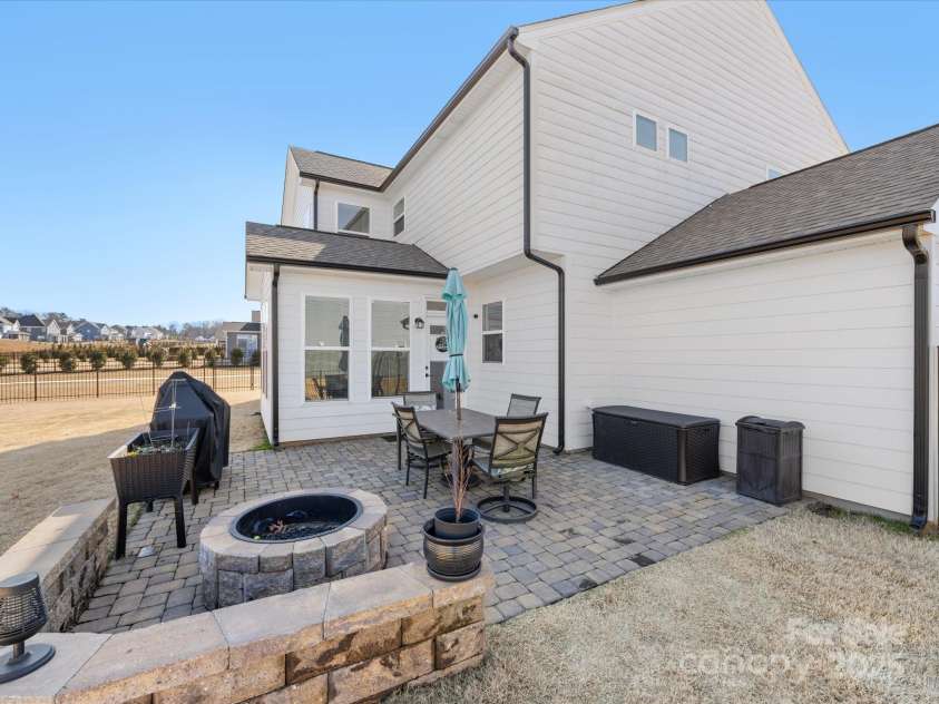 702 Yucatan Drive, Waxhaw, NC 28173.  MLS# CAR4223915, YatesRealty ID 1672. Patio pavers with fire pit