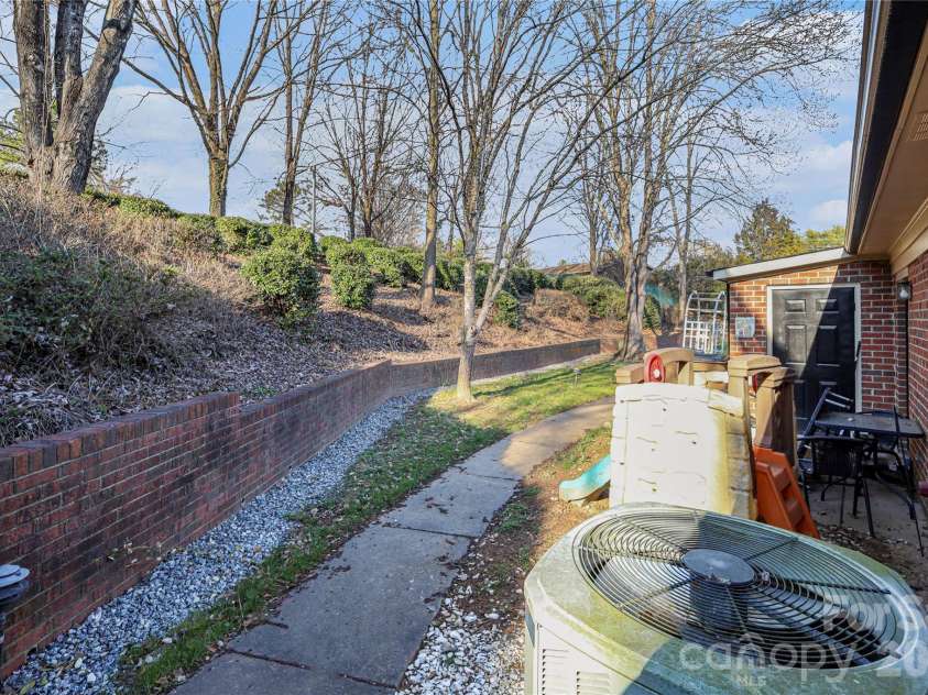 1204 Northgate Drive, Shelby, NC 28150.  MLS# CAR4349654, YatesRealty ID 16720. Retaining wall behind townhome with new drainage system