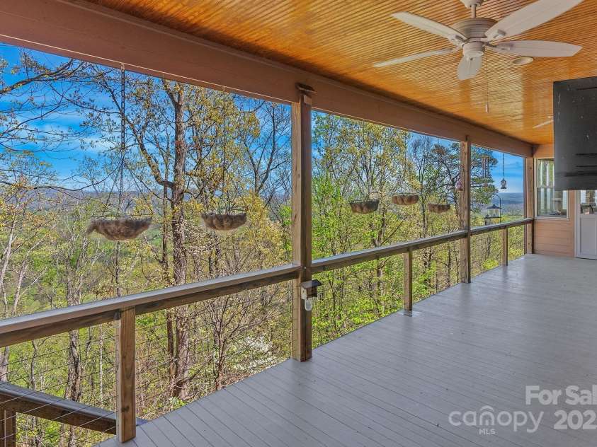 498 Pinnacle Parkway, Union Mills, NC 28167.  MLS# CAR4245645, YatesRealty ID 16732. Main level covered deck off great room