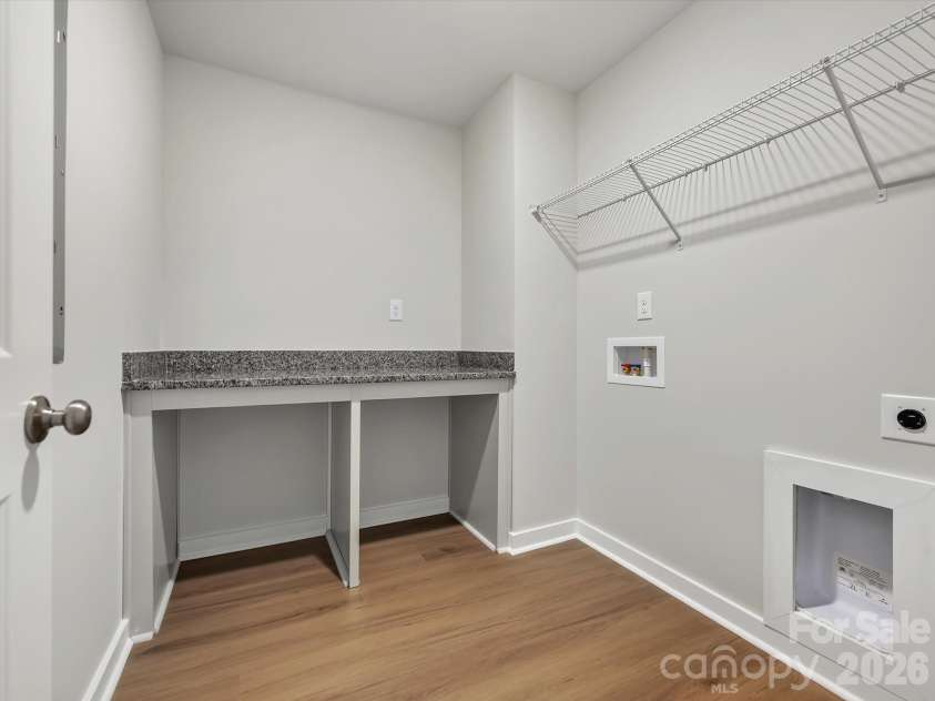 276 Alluvium Lane, Waxhaw, NC 28173.  MLS# CAR4371540, YatesRealty ID 16734. Laundry room features a folding table