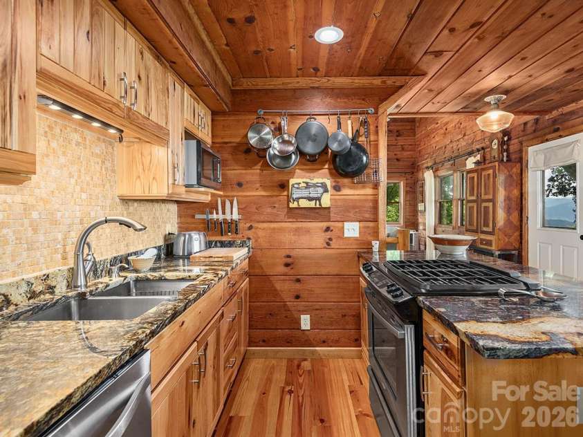 1160 High Rock Mountain Road, Marshall, NC 28753.  MLS# CAR4355296, YatesRealty ID 16741. Jaw Dropping Kitchen and High End Finishes 