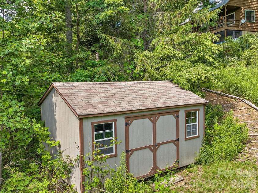 1160 High Rock Mountain Road, Marshall, NC 28753.  MLS# CAR4355296, YatesRealty ID 16741. Shed for Yard Equipment and Storage 