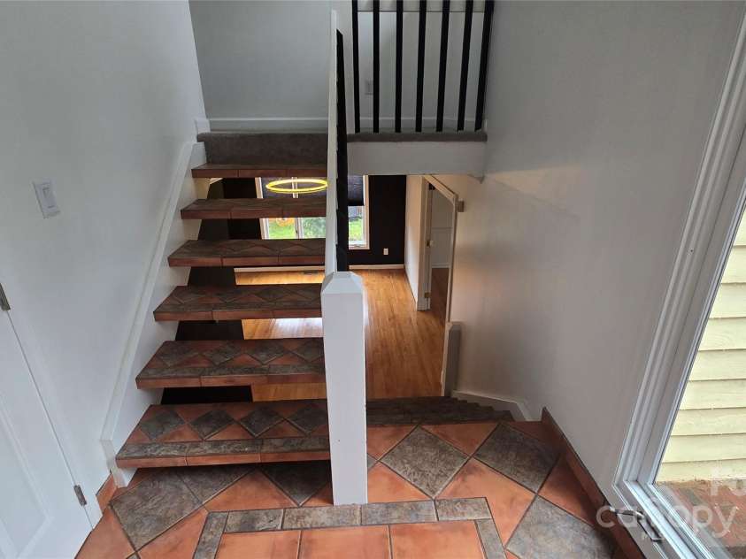 16425 Grapperhall Drive, Huntersville, NC 28078.  MLS# CAR4203228, YatesRealty ID 16749. Steps to 2 bedroom and full bathroom upstairs.