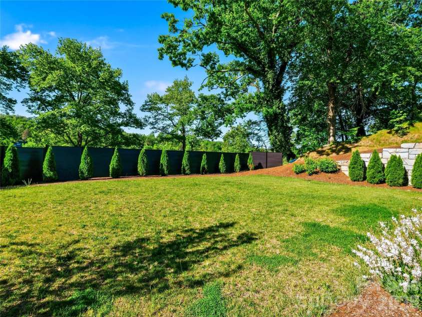 8 Midland Drive, Asheville, NC 28804.  MLS# CAR4344575, YatesRealty ID 16751. Rare level, private yard.