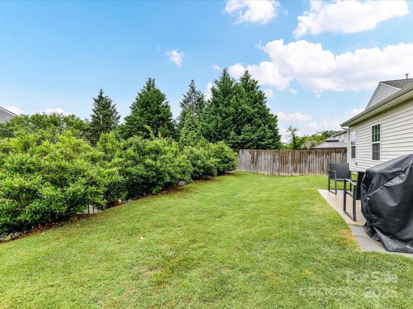 2005 Grimley Lane, Fort Mill, SC 29707.  MLS# CAR4258987, YatesRealty ID 16759. Seller tied fence into neighbors' fence to enclose