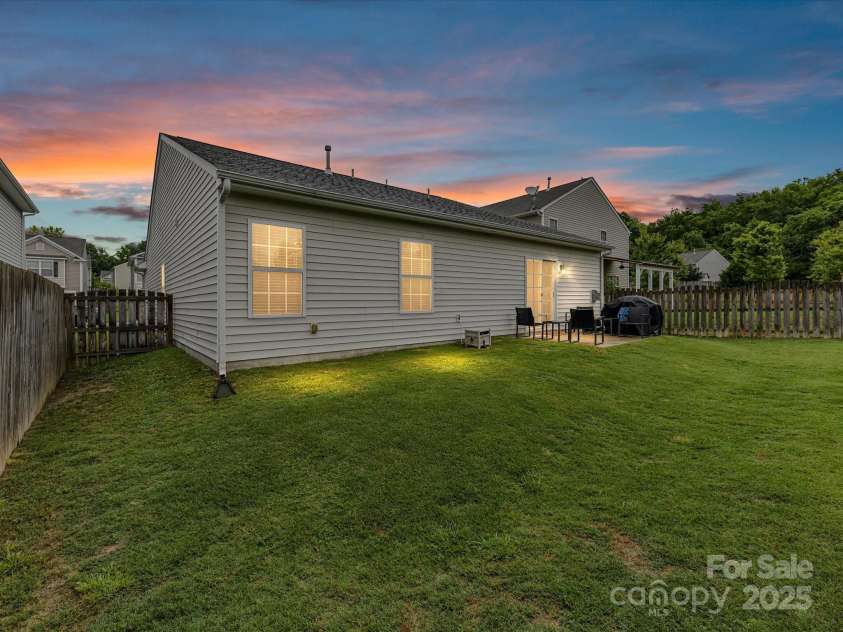 2005 Grimley Lane, Fort Mill, SC 29707.  MLS# CAR4258987, YatesRealty ID 16759. Twilight View of Rear of Home and Yard