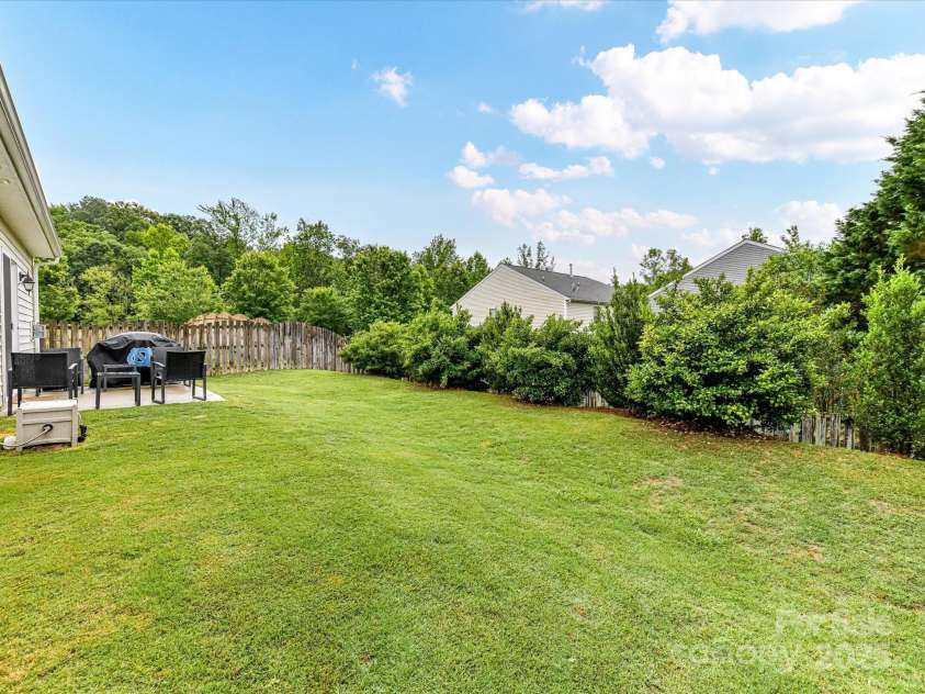 2005 Grimley Lane, Fort Mill, SC 29707.  MLS# CAR4258987, YatesRealty ID 16759. Yard with Tree Plantings for Privacy.