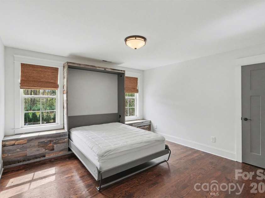 17909 Nodghia Circle, Davidson, NC 28036.  MLS# CAR4363596, YatesRealty ID 16766. Bedroom 1 With built-in Murphy Bed