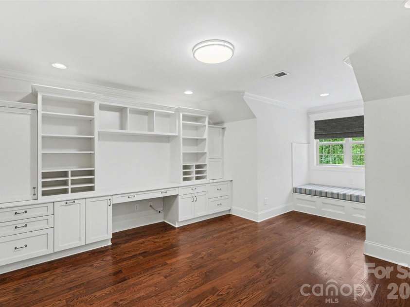 17909 Nodghia Circle, Davidson, NC 28036.  MLS# CAR4363596, YatesRealty ID 16766. Functional flex space/office with built-in features and components, utility for home office use.
