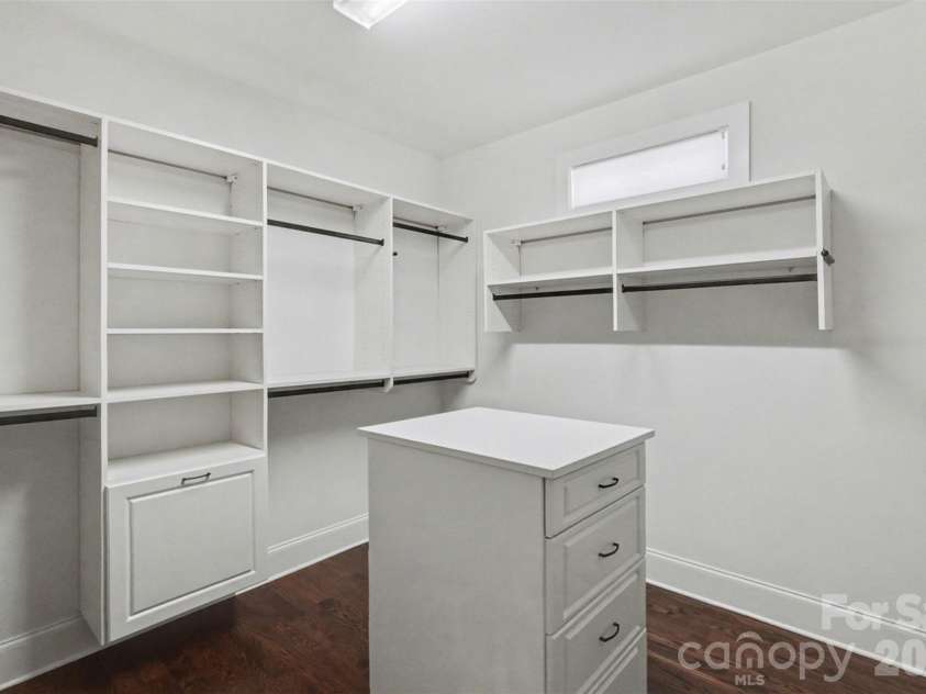 17909 Nodghia Circle, Davidson, NC 28036.  MLS# CAR4363596, YatesRealty ID 16766. Primary Closet highlights the functionality and layout, designed to accommodate both his and hers storage needs within the same space.