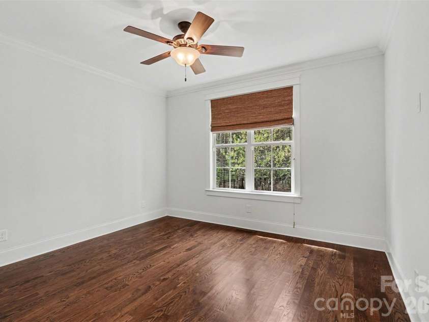 17909 Nodghia Circle, Davidson, NC 28036.  MLS# CAR4363596, YatesRealty ID 16766. Secondary Bedroom on main level. This space offers flexibility for various uses, such as a home office, guest room, or playroom, adapting to different family needs.
