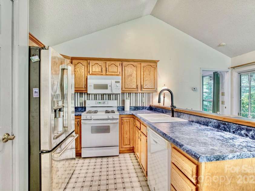 3050 Old Johns River Road, Collettsville, NC 28611.  MLS# CAR4174150, YatesRealty ID 16769. There are two kitchens