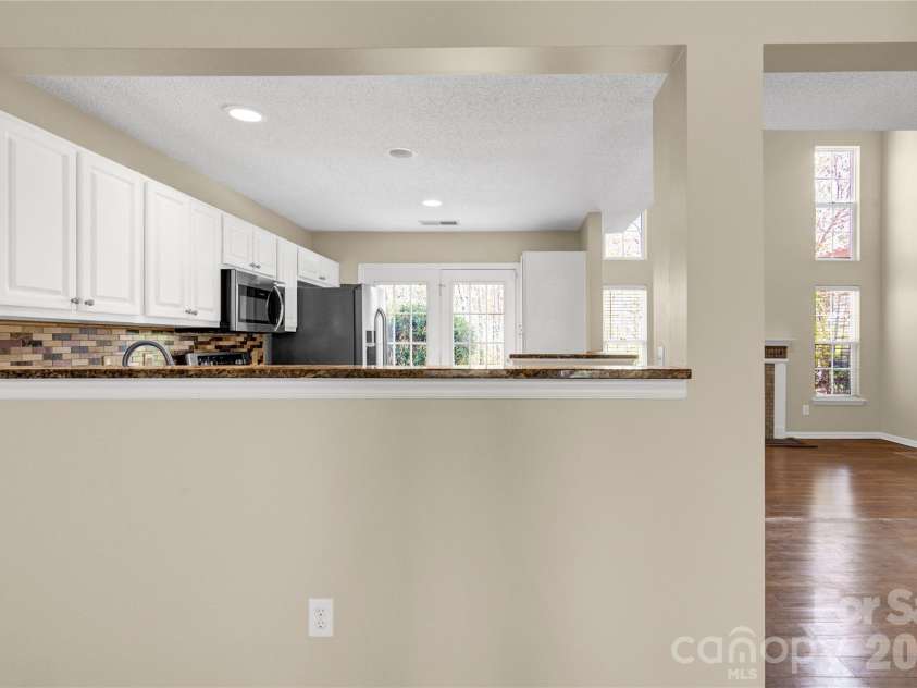 8772 Robinson Forest Drive, Charlotte, NC 28277.  MLS# CAR4389286, YatesRealty ID 16774. Kitchen from flex room
