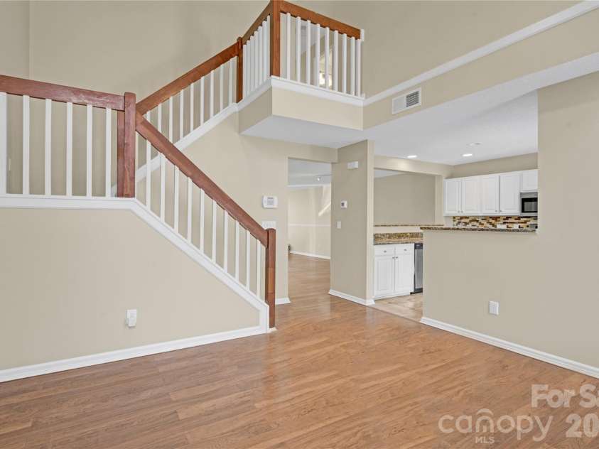 8772 Robinson Forest Drive, Charlotte, NC 28277.  MLS# CAR4389286, YatesRealty ID 16774. Stairs from living room to upstairs