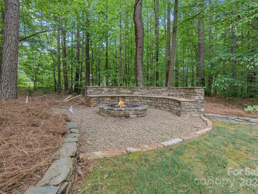 4877 River Hills Drive, Denver, NC 28037.  MLS# CAR4254498, YatesRealty ID 16775. Fire pit with custom bench.