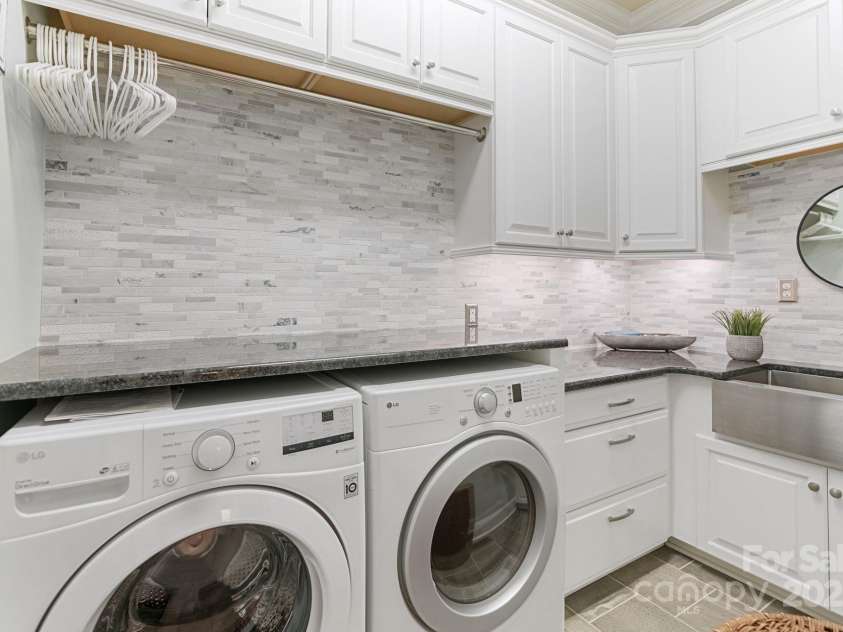 4877 River Hills Drive, Denver, NC 28037.  MLS# CAR4254498, YatesRealty ID 16775. Laundry with farm sink and tons of cabinet space.