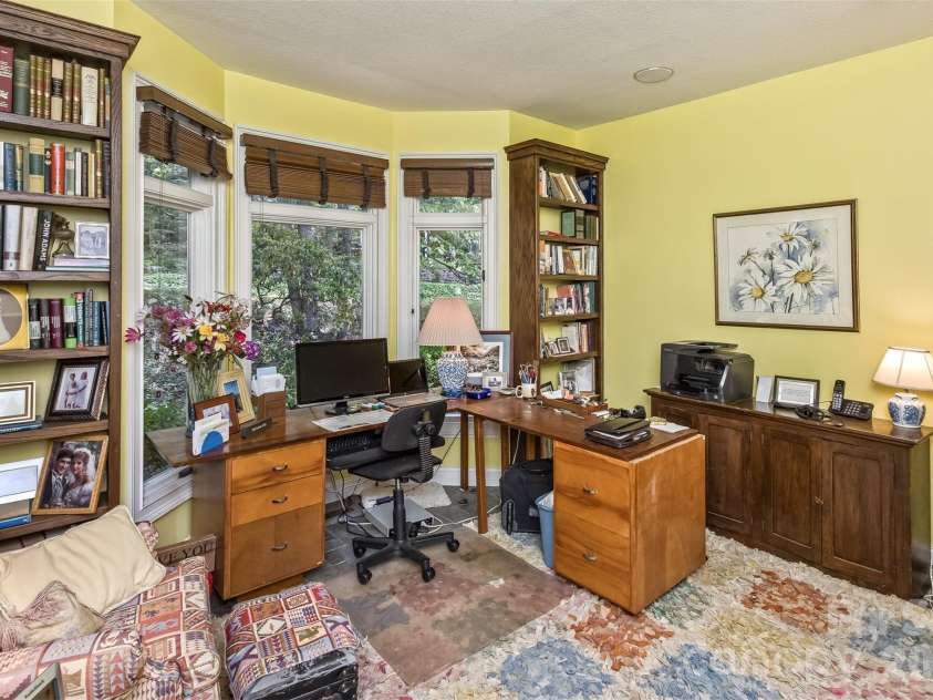 25 Windsong Drive, Fairview, NC 28730.  MLS# CAR4370725, YatesRealty ID 16777. Den on main level currently used as office