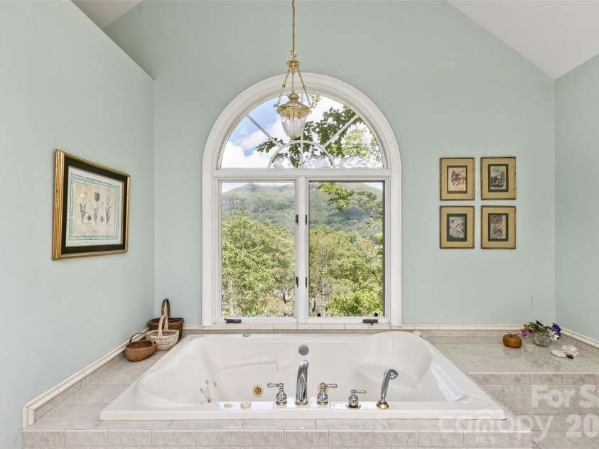 25 Windsong Drive, Fairview, NC 28730.  MLS# CAR4370725, YatesRealty ID 16777. Ensuite jacuzzi with Views!
