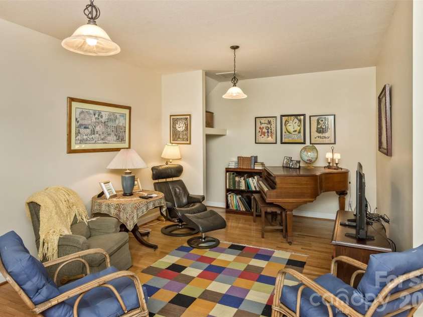 25 Windsong Drive, Fairview, NC 28730.  MLS# CAR4370725, YatesRealty ID 16777. Large downstairs open space - current owners have dance parties here!