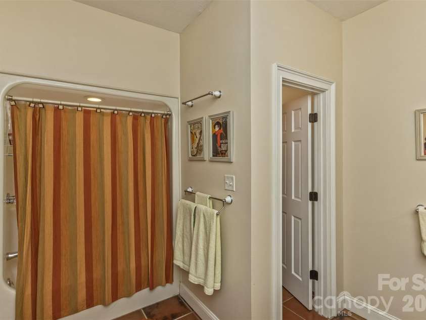 25 Windsong Drive, Fairview, NC 28730.  MLS# CAR4370725, YatesRealty ID 16777. Lower level bathroom