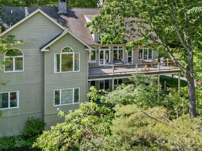 25 Windsong Drive, Fairview, NC 28730.  MLS# CAR4370725, YatesRealty ID 16777. Main level living with ample lower level for guests