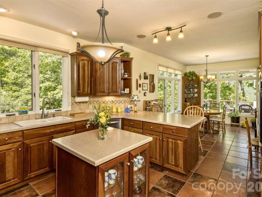 25 Windsong Drive, Fairview, NC 28730.  MLS# CAR4370725, YatesRealty ID 16777. Super functional Kitchen with Island and Counter Eating Area