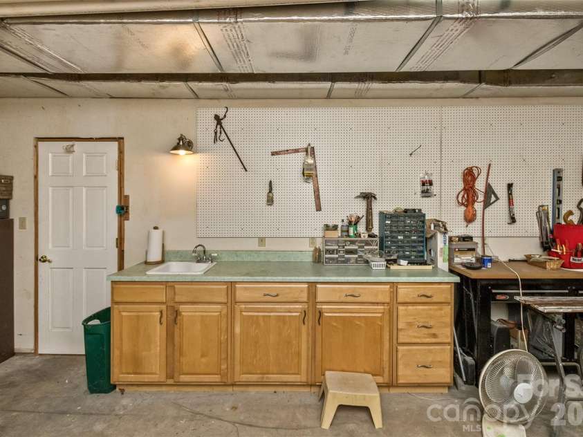 25 Windsong Drive, Fairview, NC 28730.  MLS# CAR4370725, YatesRealty ID 16777. Workshop offers another closet as well