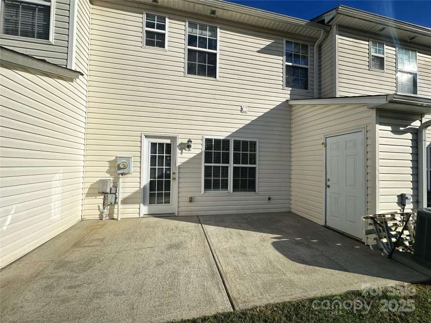 4143 Kenton Glenn Court, Concord, NC 28027.  MLS# CAR4286891, YatesRealty ID 16777. Back of townhome