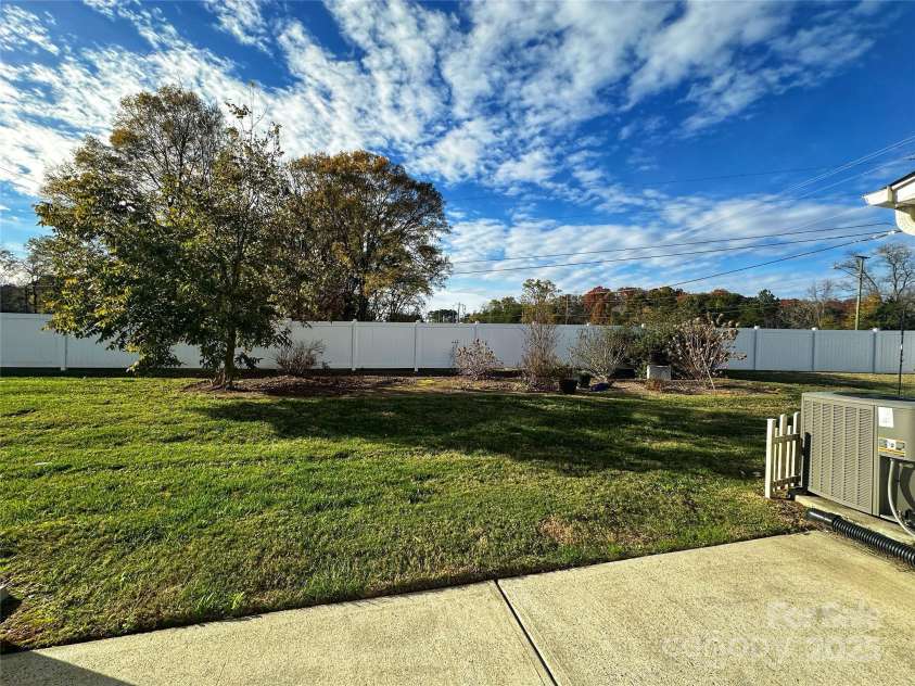 4143 Kenton Glenn Court, Concord, NC 28027.  MLS# CAR4286891, YatesRealty ID 16777. Back yard view from patio