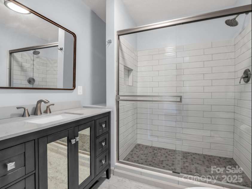 232 Stonebrook Drive, Hendersonville, NC 28791.  MLS# CAR4226613, YatesRealty ID 16783. #1Main Bathroom