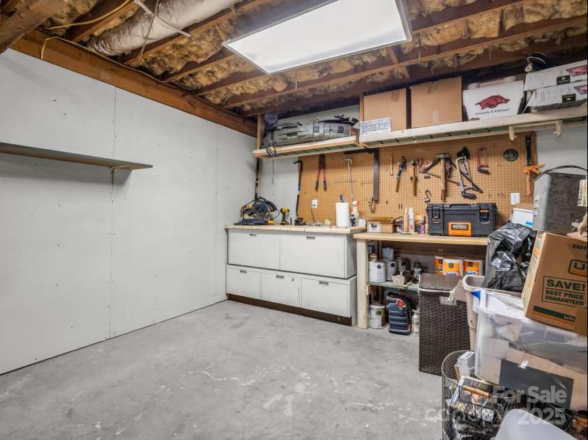232 Stonebrook Drive, Hendersonville, NC 28791.  MLS# CAR4226613, YatesRealty ID 16783. Basement Workshop