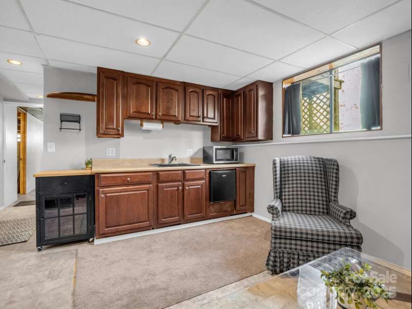 232 Stonebrook Drive, Hendersonville, NC 28791.  MLS# CAR4226613, YatesRealty ID 16783. Basement X-Kitchen area